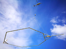 Helicopter carrying a contraption for the water mapping process
