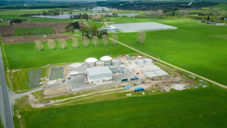 Bird's eye view image of the Reporoa facility - white buildings and machinery sitting amongst vibrant green fields