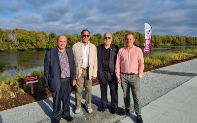 Te Kenehi Teira, Ben Dalton, Robin Hapi, Arjan van der Boon standing in front of the Foxton river loop