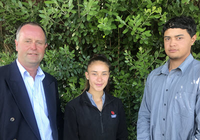 Stuart Ellingham, Galaxie Waihape, and Paris Robinson in front of a tree.