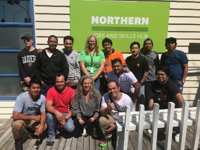 A group of people gathered for a photo outside the Northern Jobs and Skills Hub.