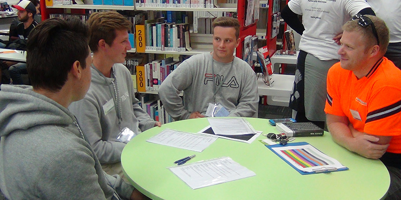 Three rangatahi practicing interview skills on a YETE programme.