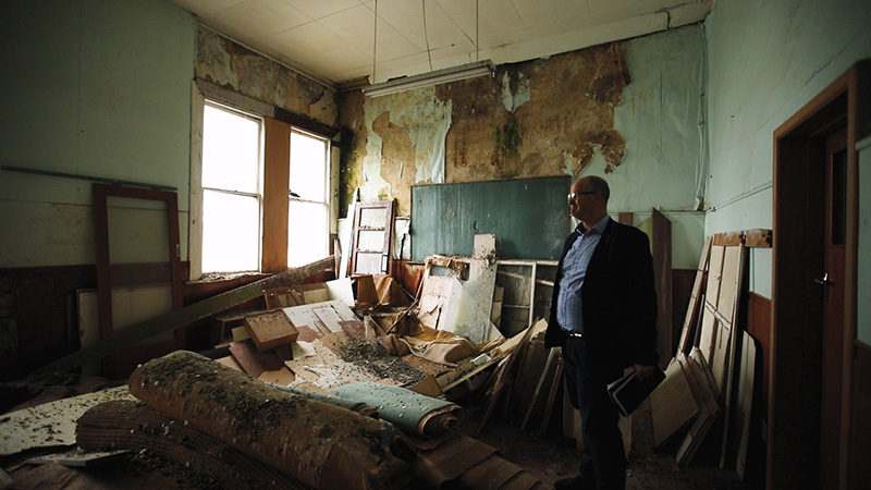 Scott O'Donnell in a damaged Invercargill building.