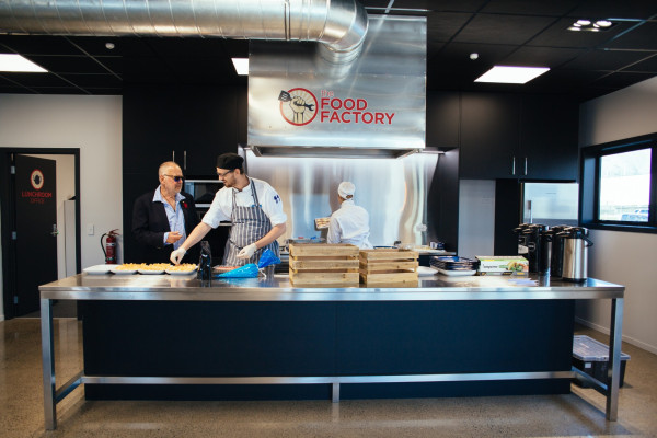 Three people active in the Food Factory Kitchen